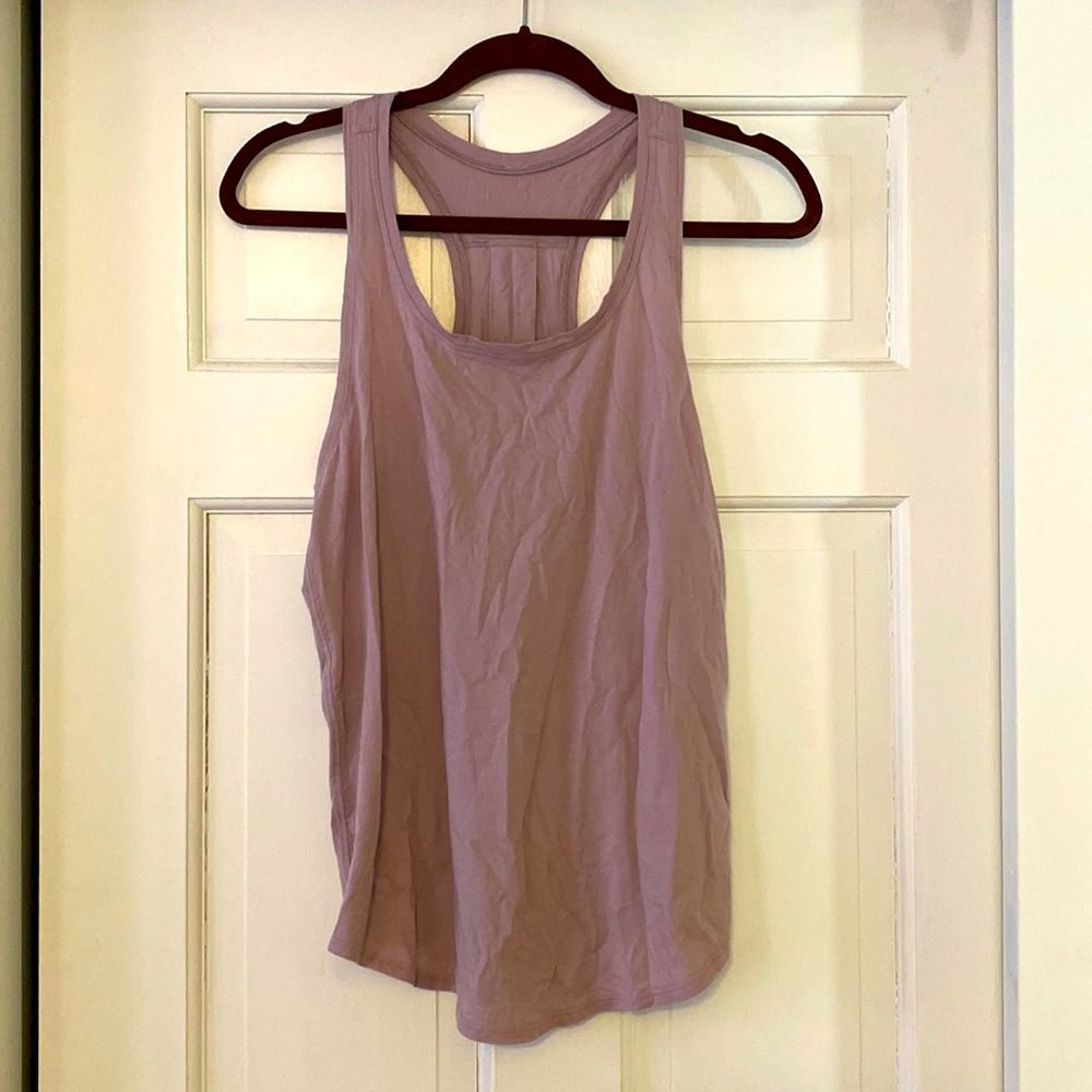 Mauve tank. Worn once. Good condition.